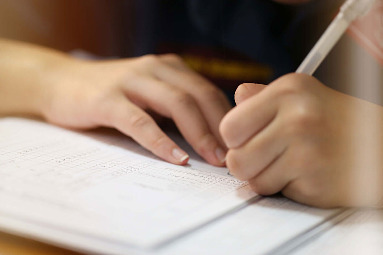 lady writing on paper